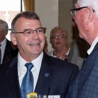 Tim McKee talking with a guest.